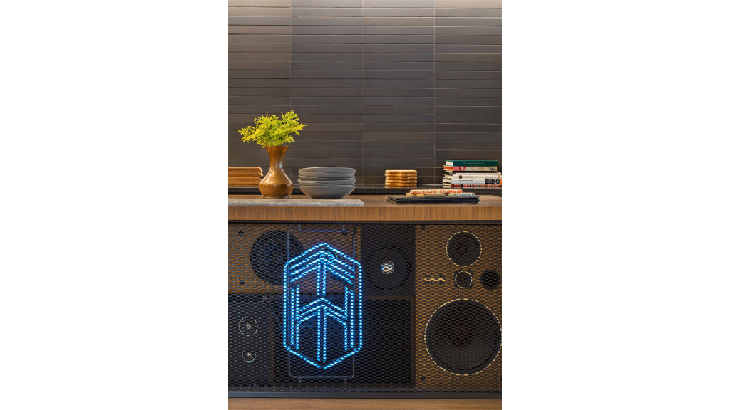 A bird cage with a plant in it.