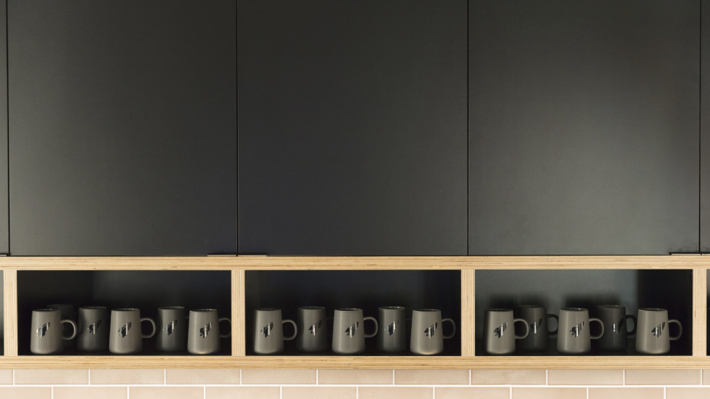 A shelf with cups on it.