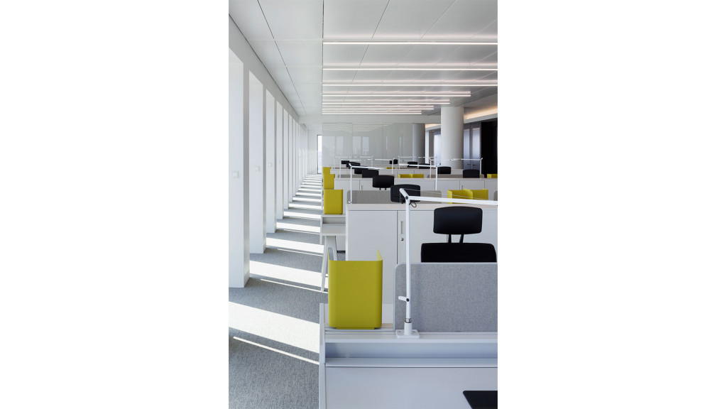 A room with a staircase and chairs.