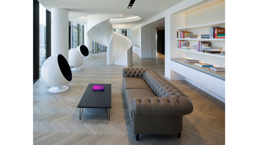 A room with a couch and a table.