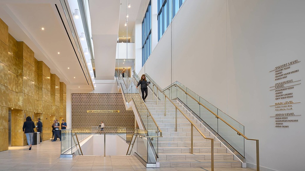 People walking up a staircase.