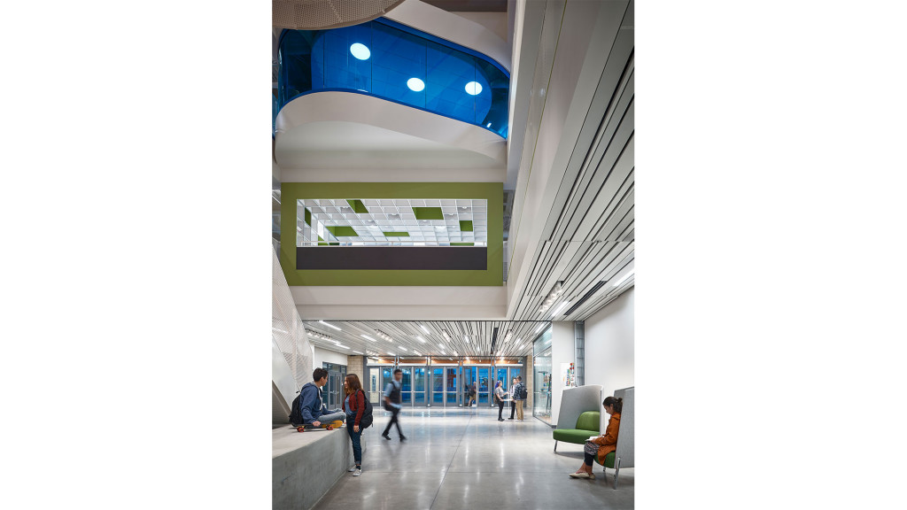 A group of people walking in a building.