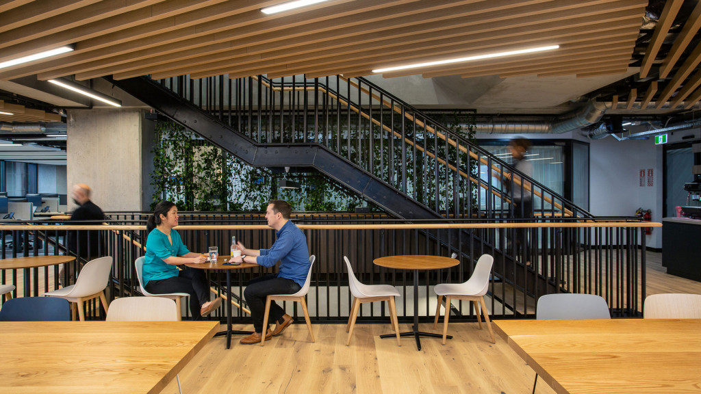 People sitting at tables in a room.