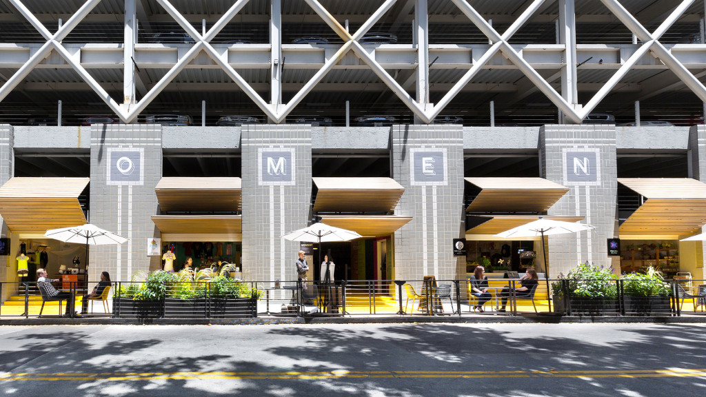 People sitting under umbrellas.