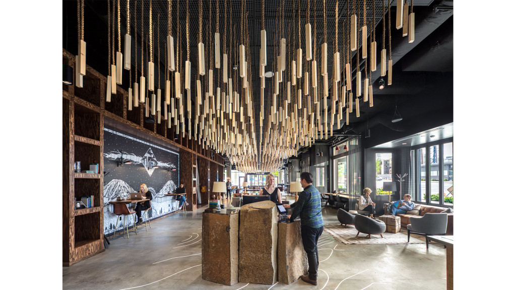 A room with people and bookshelves.