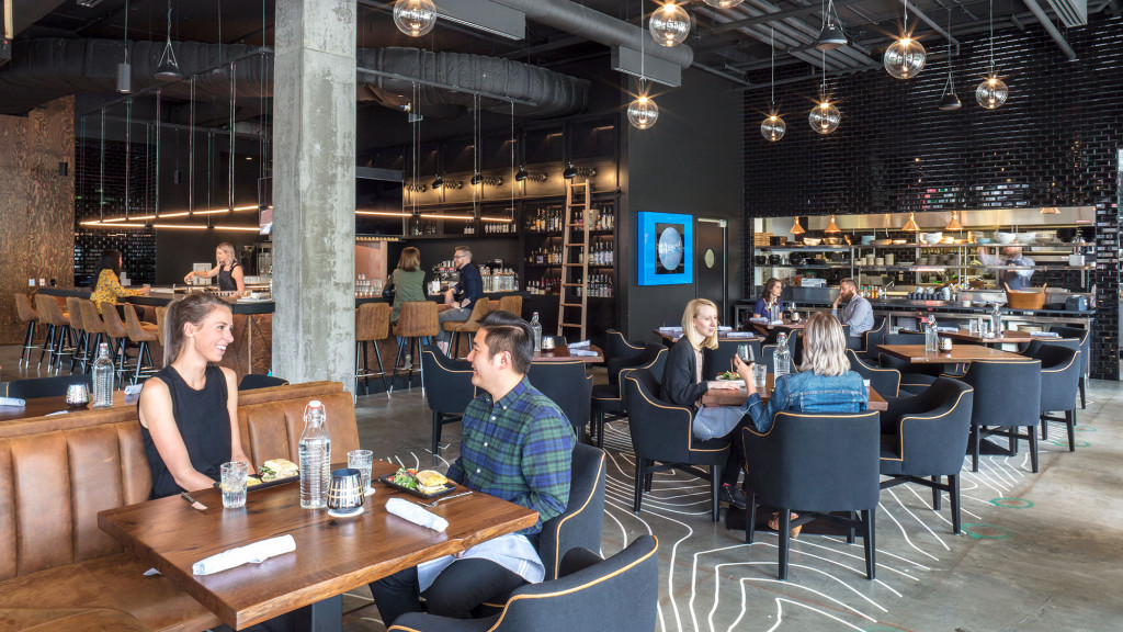 A group of people sitting at tables.