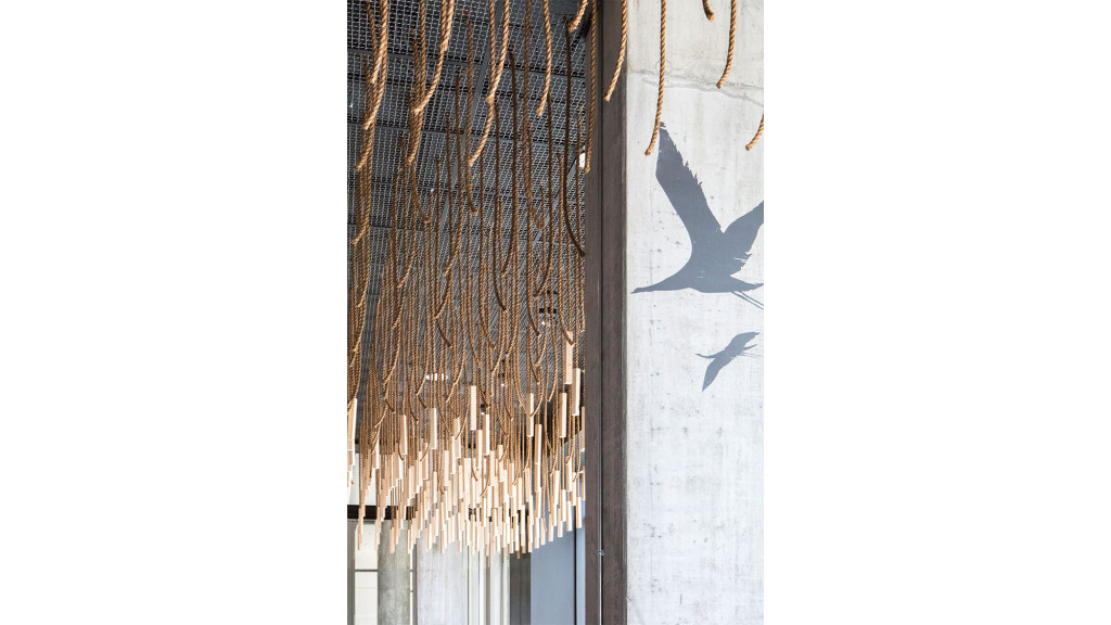 A tall building with a shadow.