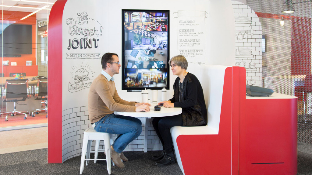A man and a woman sitting at a table.