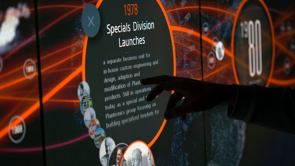 A person holding a bottle.