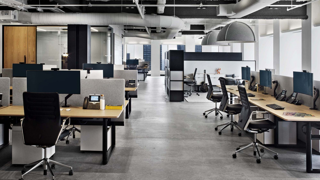 An empty office with several computers.
