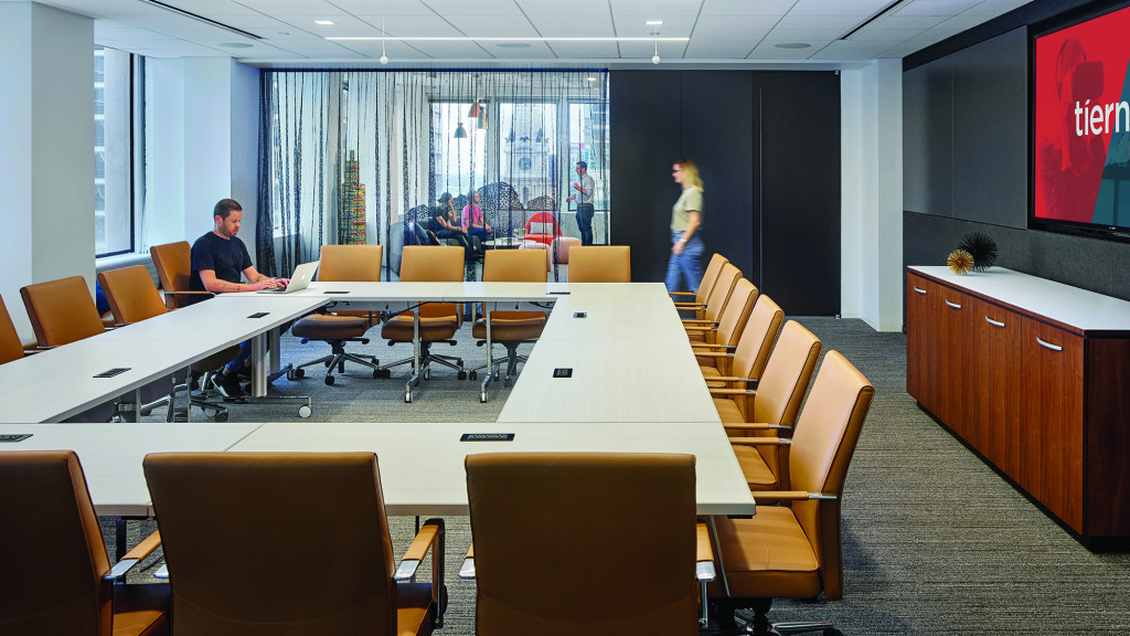 A person standing at a table.