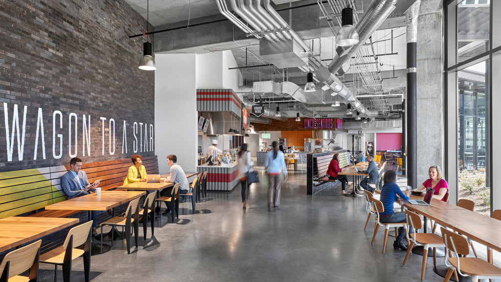 People sitting at tables in a building.