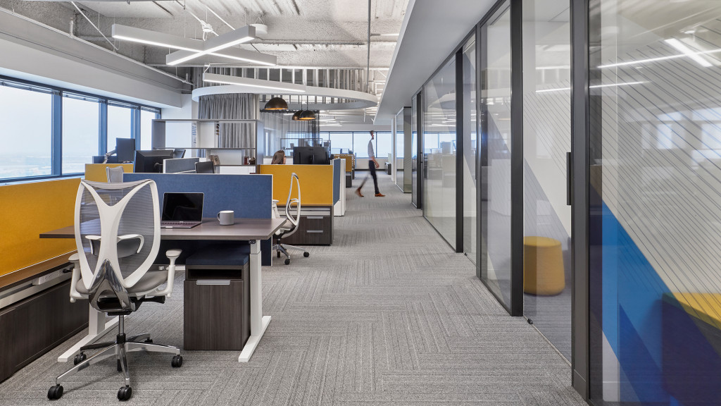 An office with a desk and chairs.