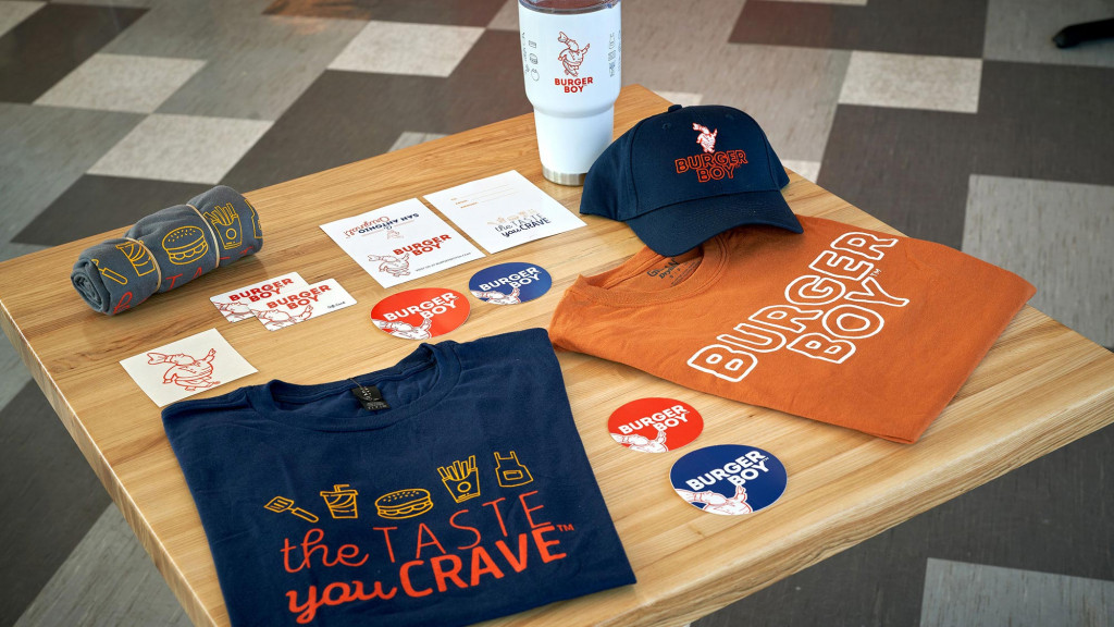 A table with a hat and cards on it.