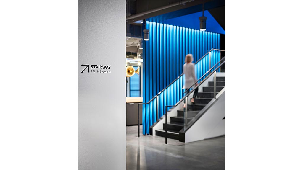 A man walking up a flight of stairs.