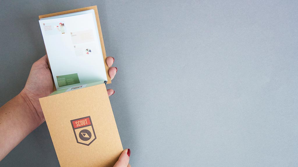 A hand holding a box.