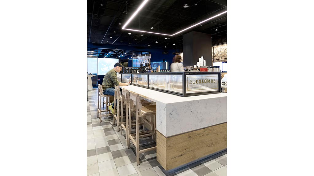 A person sitting at a counter.