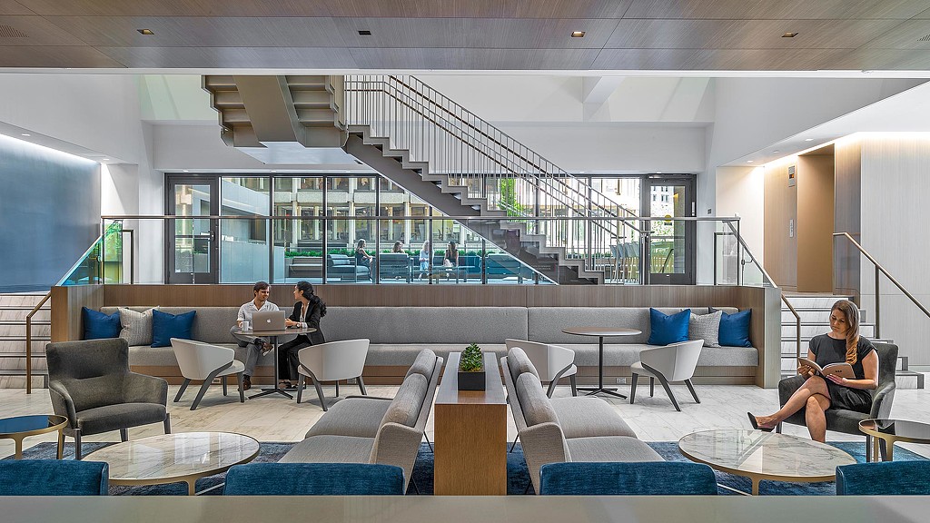 A few people sitting in a room.