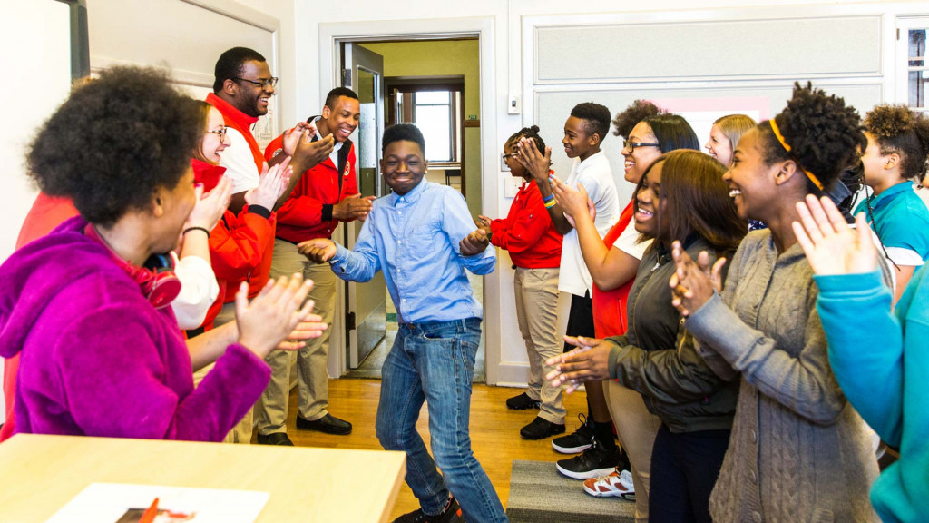 A group of people standing in a room.
