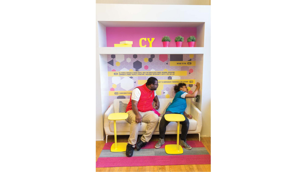 A man and woman sitting on a couch.