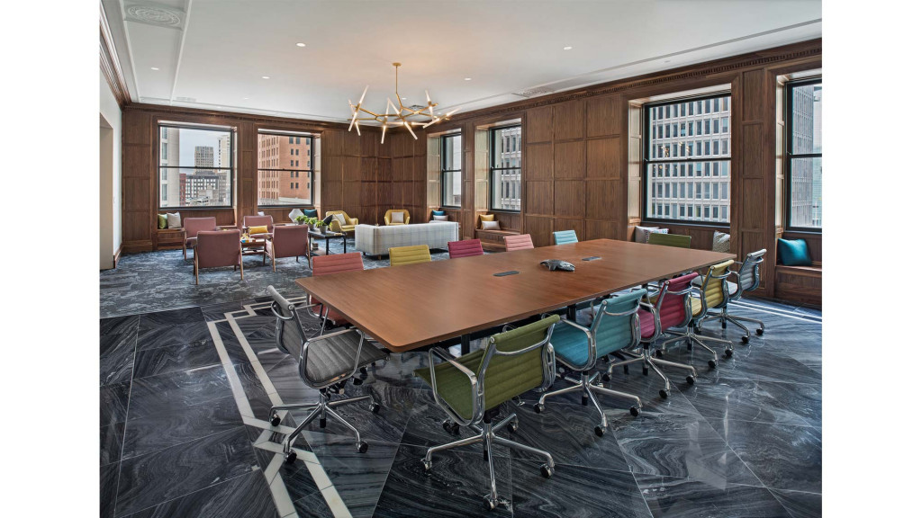 A room with a table and chairs.