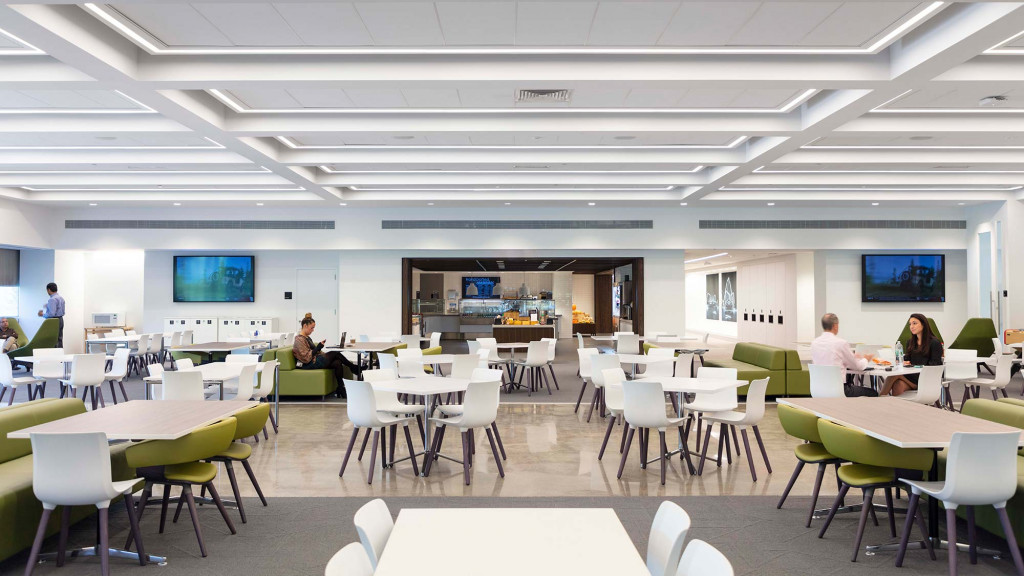 A group of people sitting at tables.