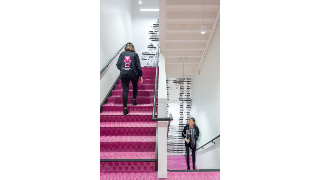 A person walking down a flight of stairs.