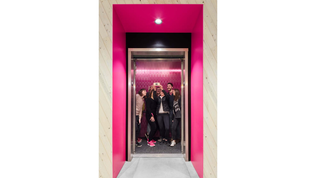 A group of people standing in a doorway.