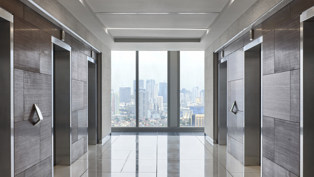 A room with a view of a city.