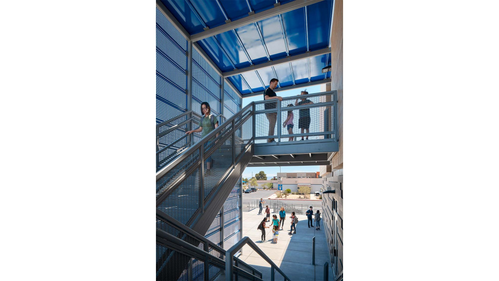 People walking up a staircase.