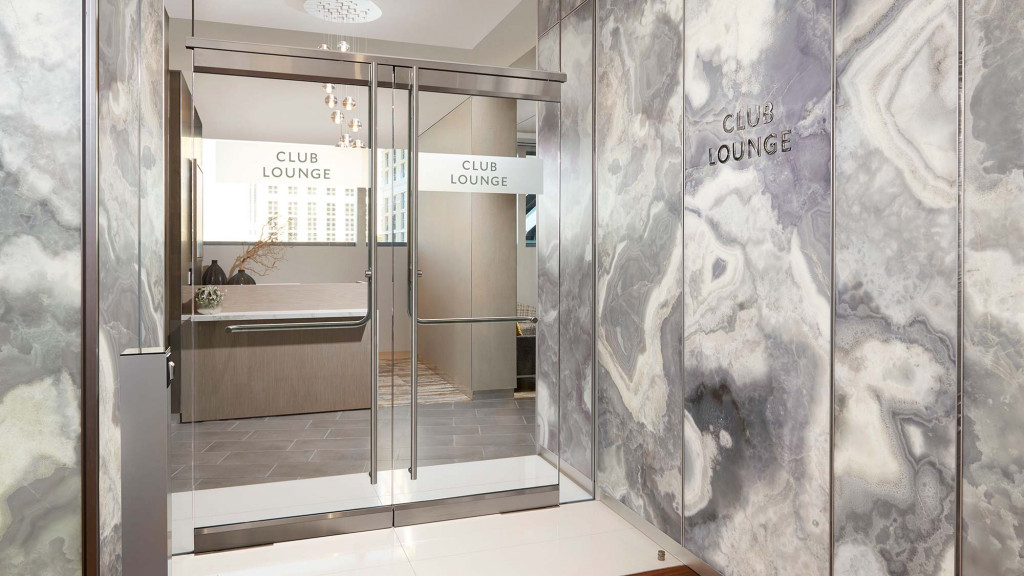 A glass walled bathroom.