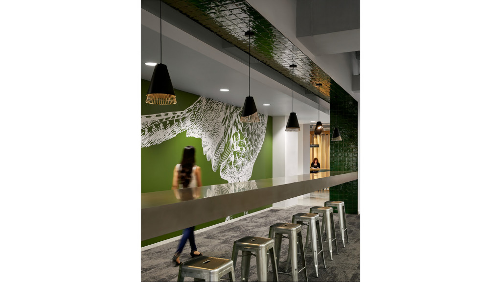 A person walking down a hall.