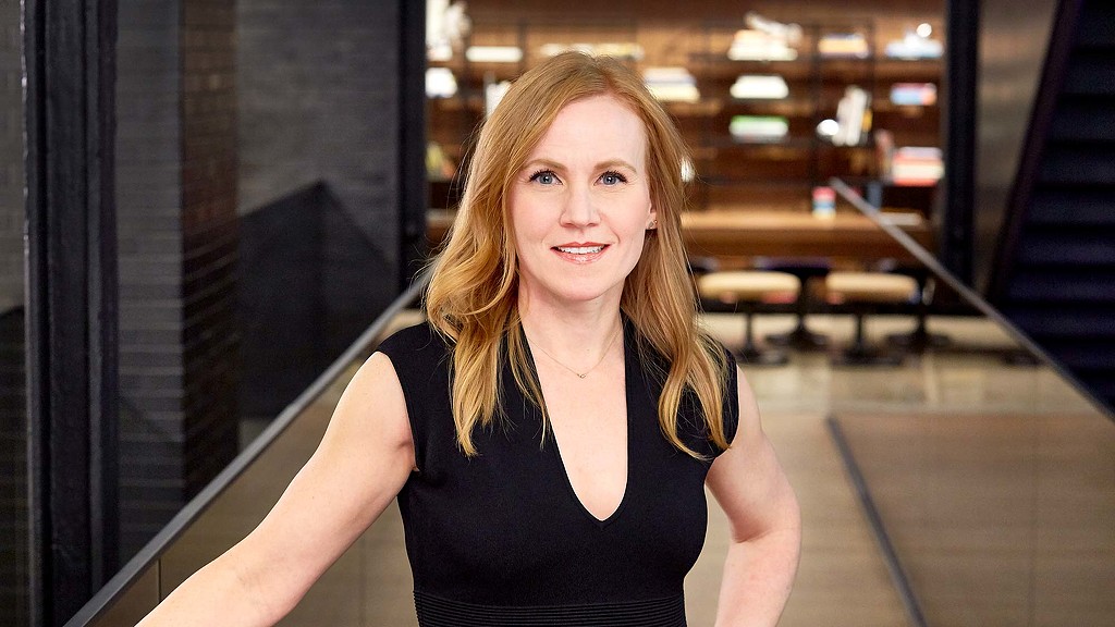 A woman standing in a room.