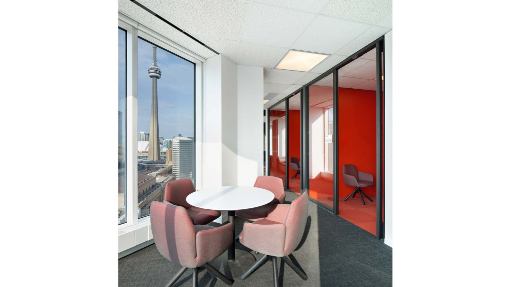 A room with a table and chairs.