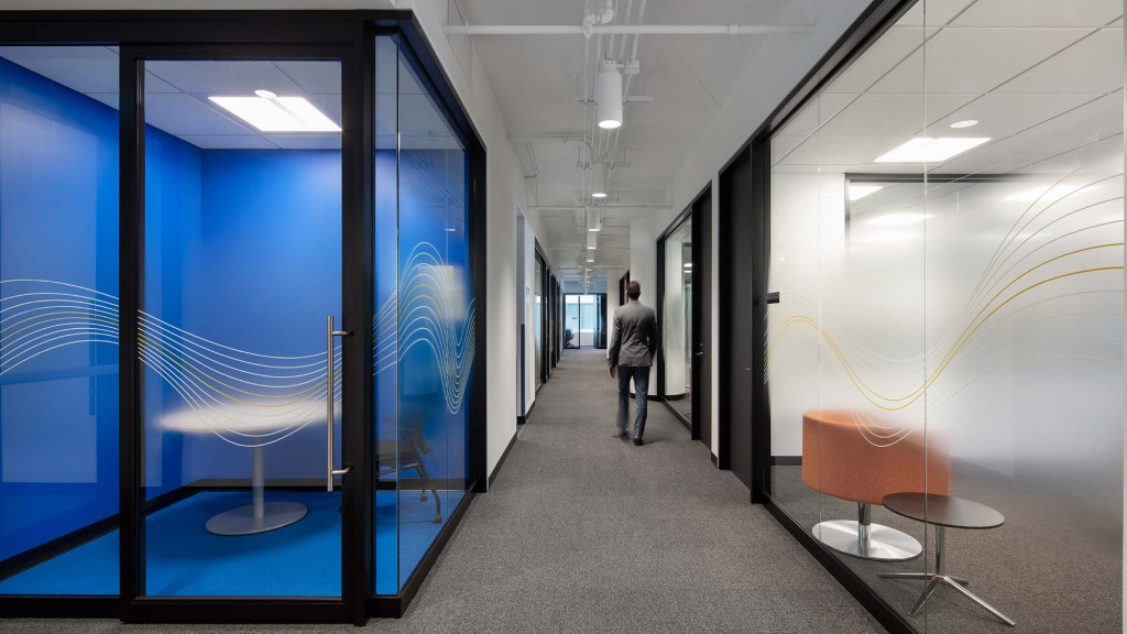 A person walking through a hallway.