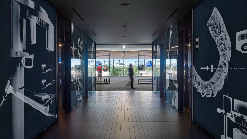 A person standing in a hallway.