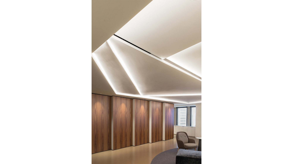 A room with a chair and a table.