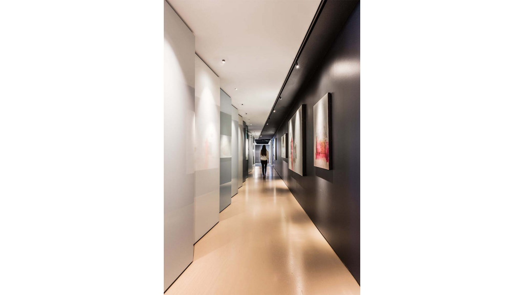 A person walking down a hallway.