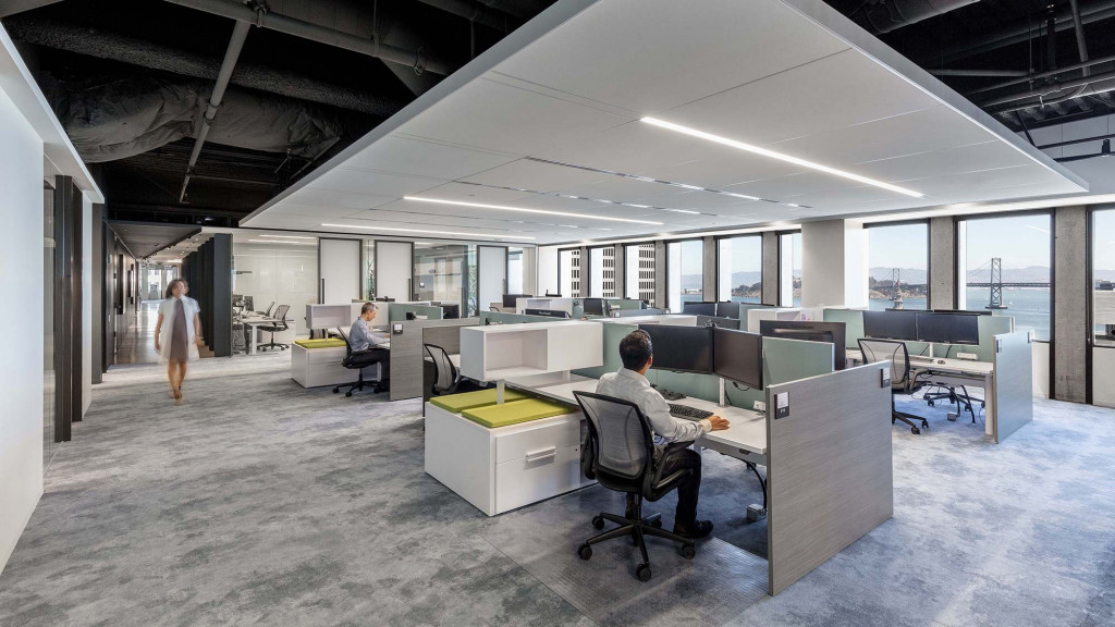 A person sitting at a desk in an office.