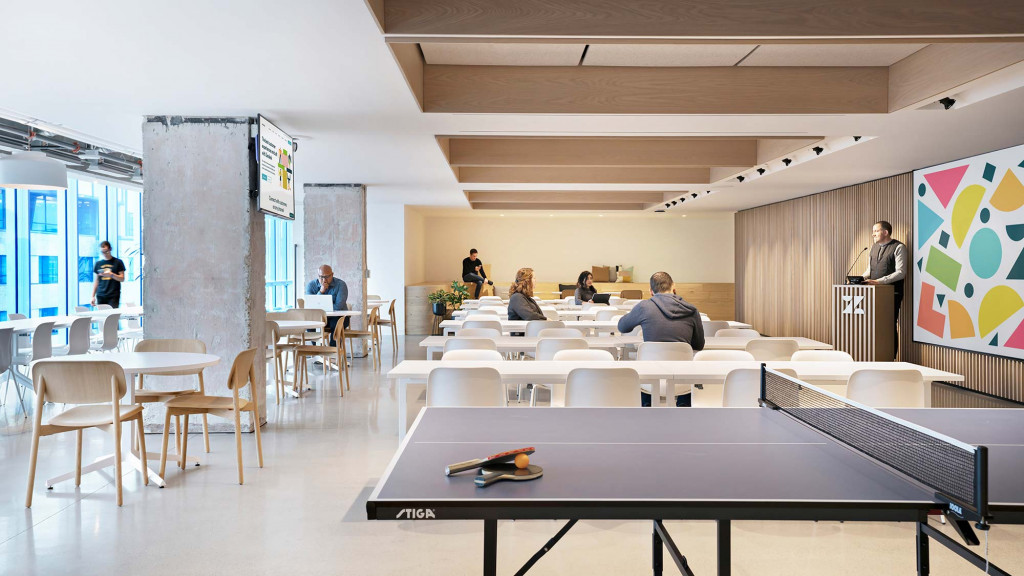A group of people sitting at tables.