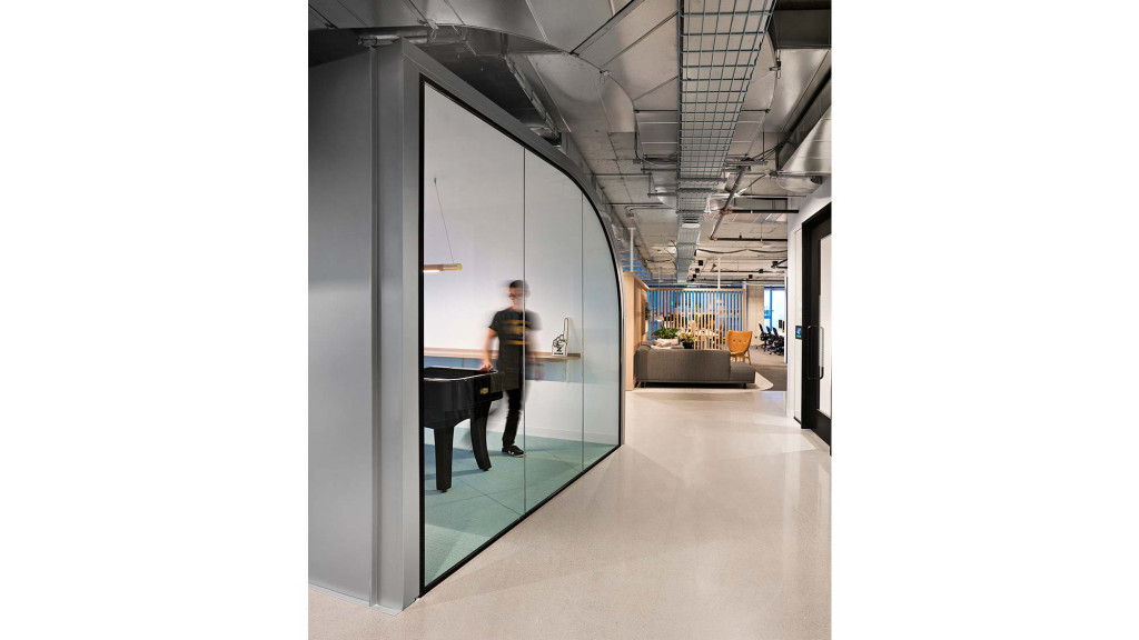 A person standing in a hallway.