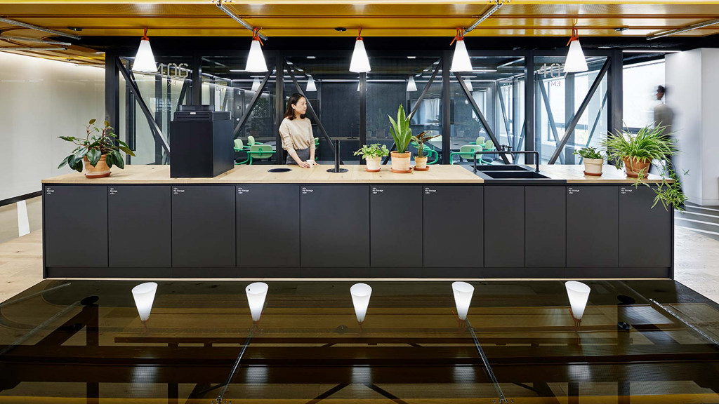 A person standing behind a counter.