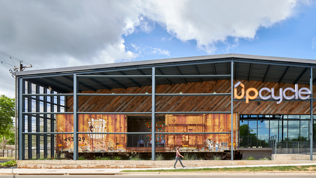 A person walking outside of a building.