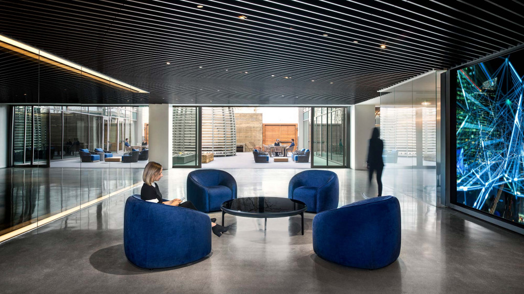 A person sitting on a blue couch.