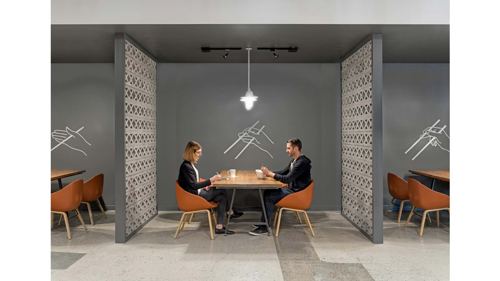 A man and woman sitting at a table.