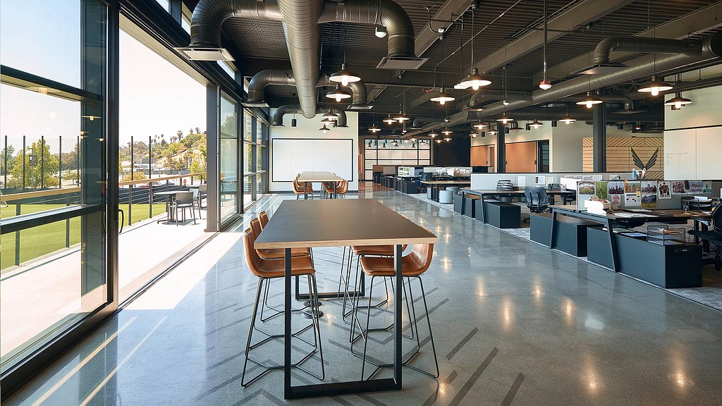 A large room with tables and chairs.