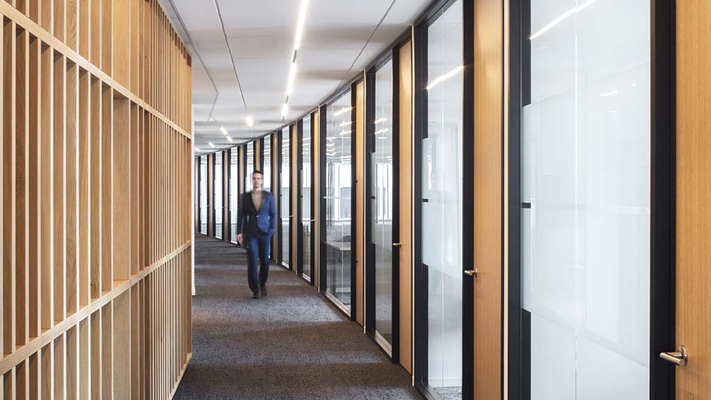A person walking down a hallway.
