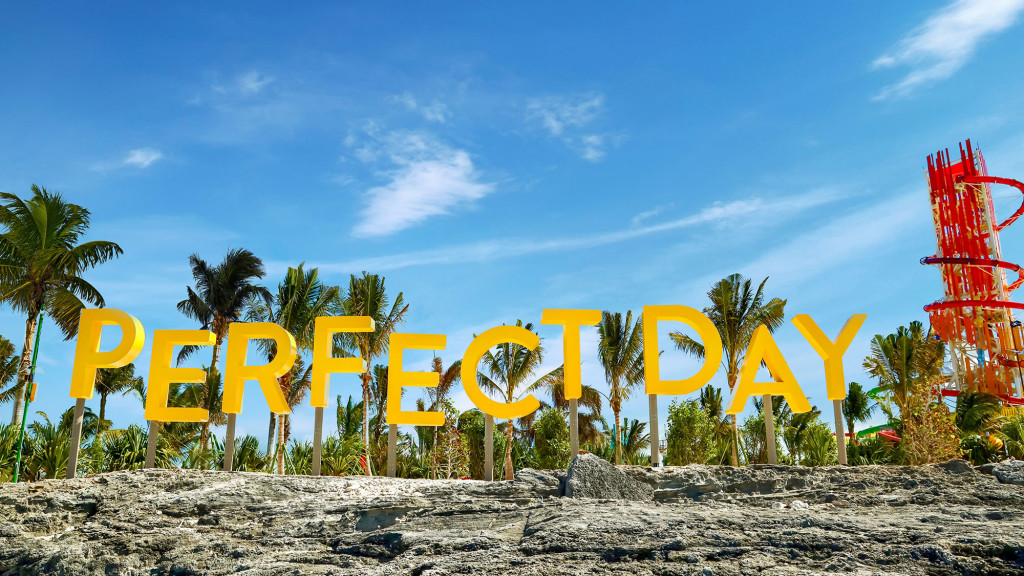 A beach with yellow letters.