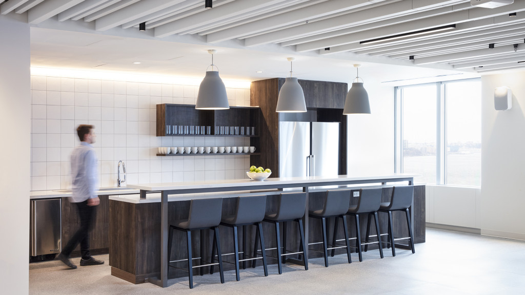 A person standing in a kitchen.