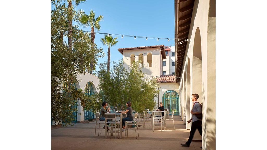A group of people sitting outside.